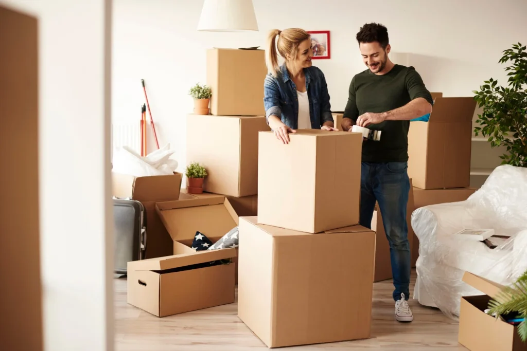 couple-packing-stuff-among-plenty-cardboard-boxes(2)(2)